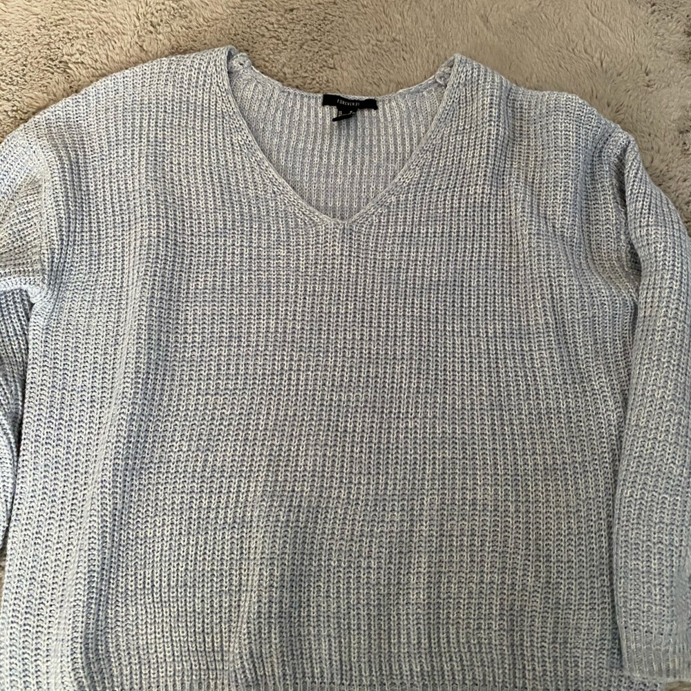 light blue sweater